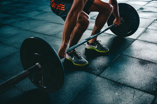 Man doing romanian deadlift.